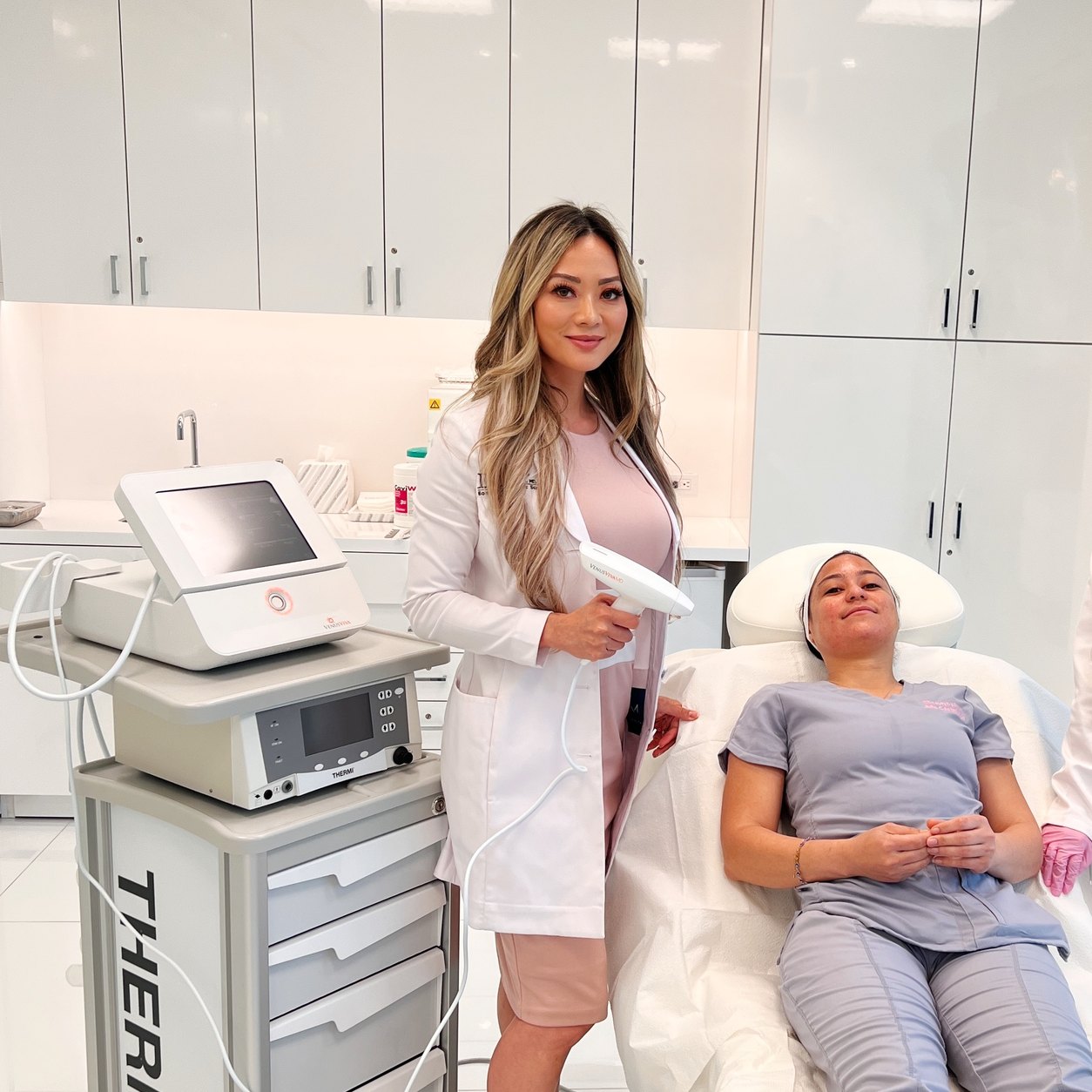 Dr. Cat Begovic holding the Venus Viva MD handpiece beside a patient in the treatment room at Dr. Cat Plastic Surgery in Beverly Hills