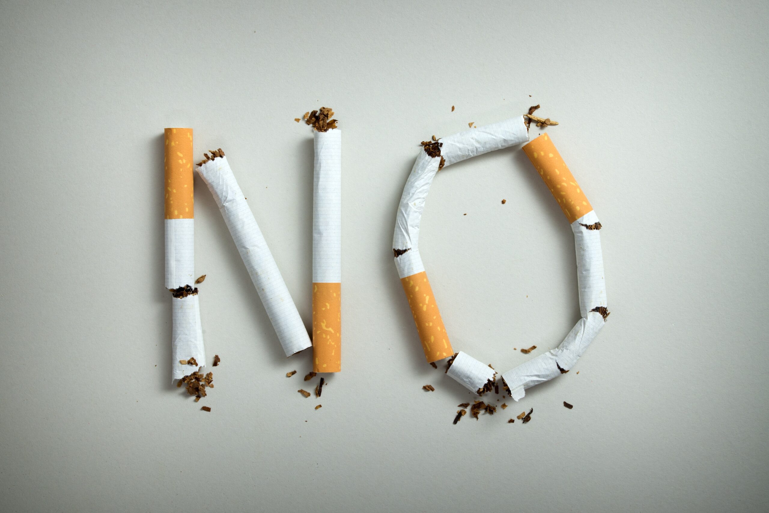 No smoking sign made with broken cigarettes